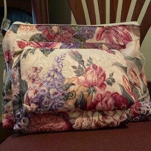 NWT cosmetic case multi color florals. Three different sizes.